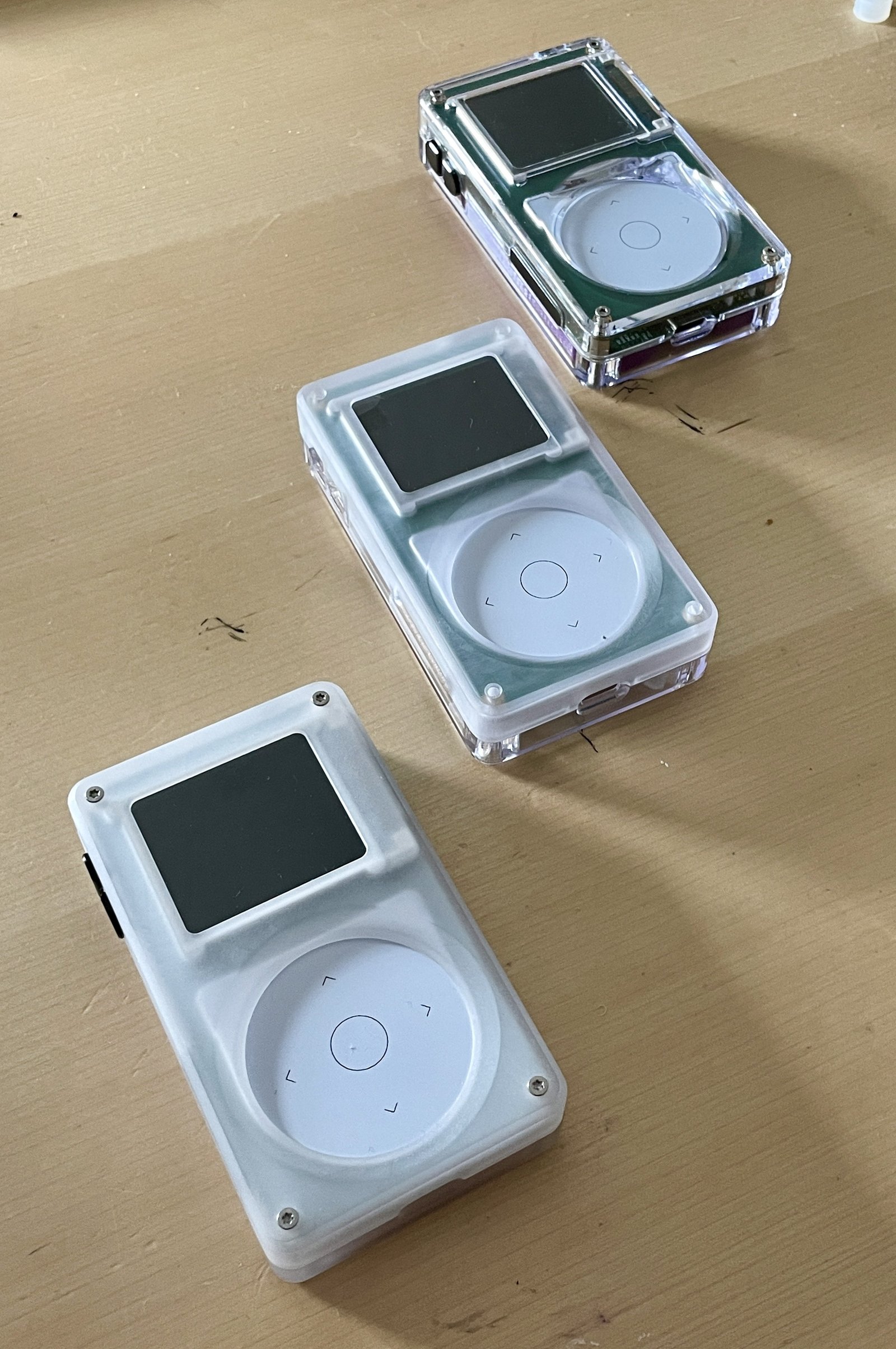 three tangara music players with different case finishes